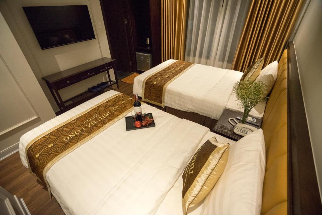 Postel nebo postele na pokoji v ubytování An Phu Ha Long Villa