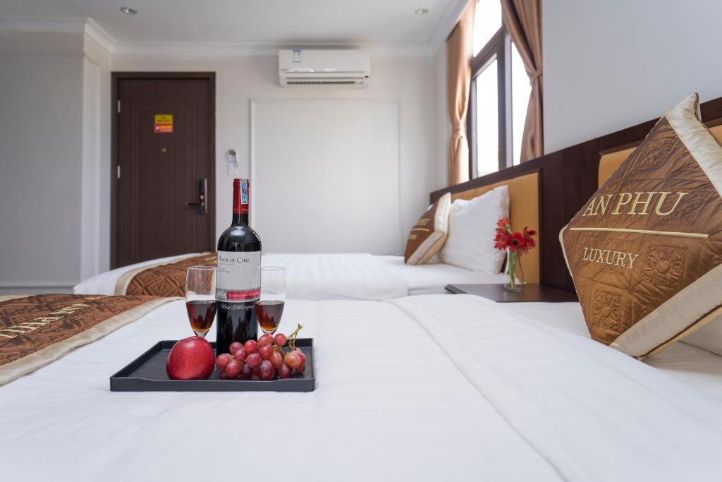 Postel nebo postele na pokoji v ubytování An Phu Ha Long Villa