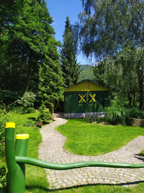 a garden hose in front of a shed at Na Jamajce in Šternberk