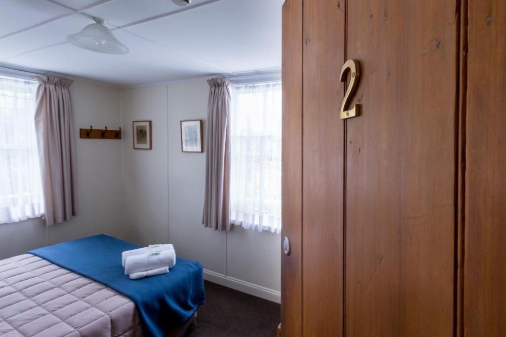 Postel nebo postele na pokoji v ubytování The Greytown Hotel