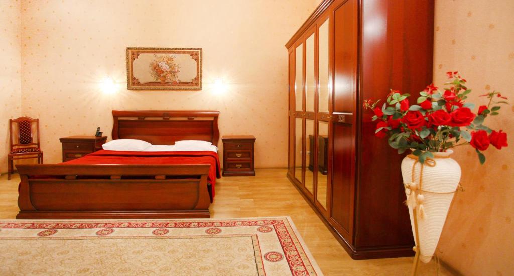 Postel nebo postele na pokoji v ubytování Ekaterina Hotel