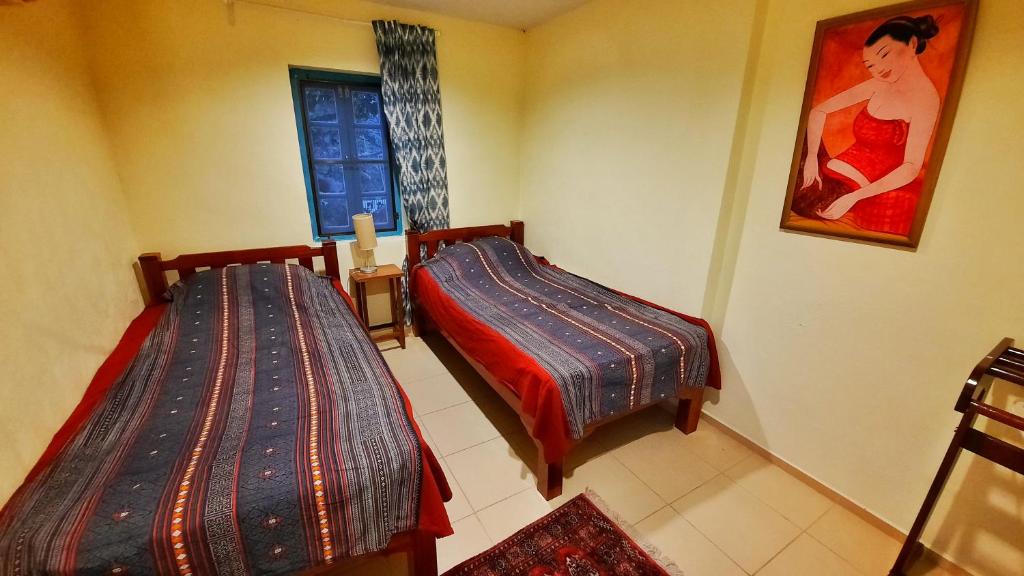 Postel nebo postele na pokoji v ubytování Kampu Nature Pool Villa Rayong