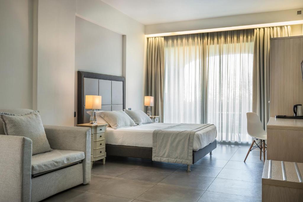 Postel nebo postele na pokoji v ubytování ASTRA Village Resort