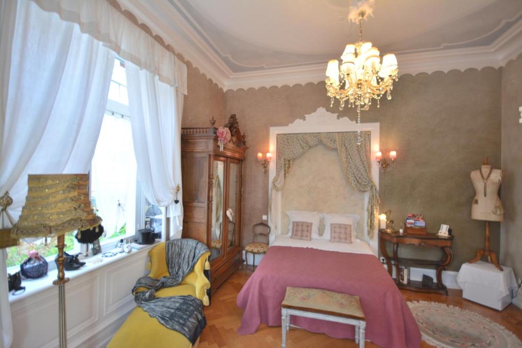 Postel nebo postele na pokoji v ubytování Castelnau