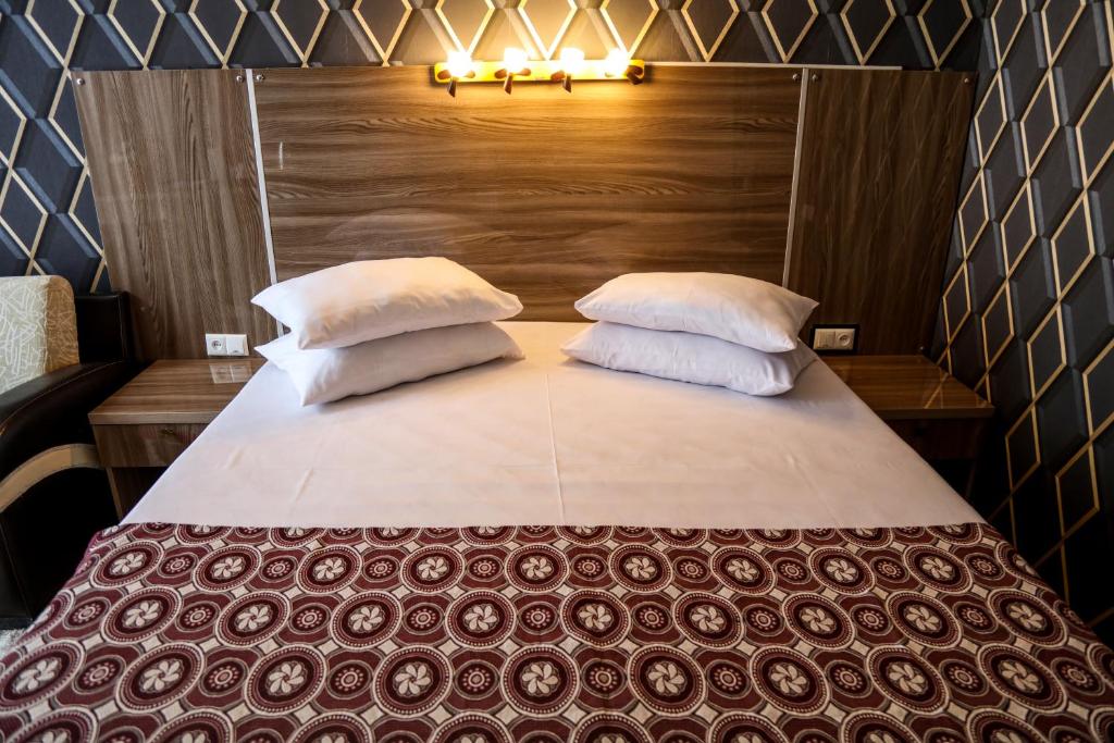Postel nebo postele na pokoji v ubytování Hotel Borjomi Aisi