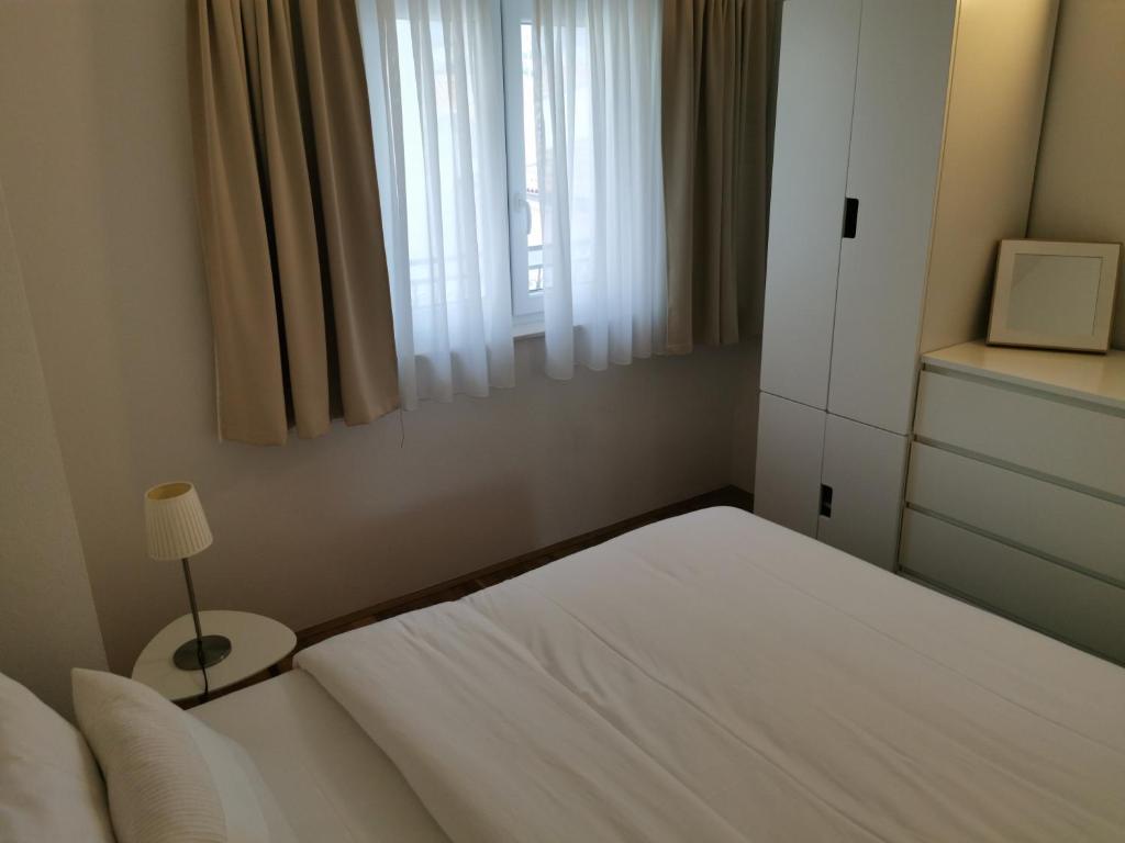 Postel nebo postele na pokoji v ubytování Apartments Dvor - ap1, ap2, ap3