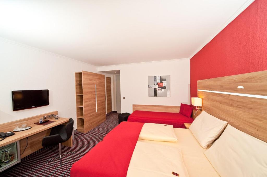 TV a/nebo společenská místnost v ubytování Superior Hotel Präsident