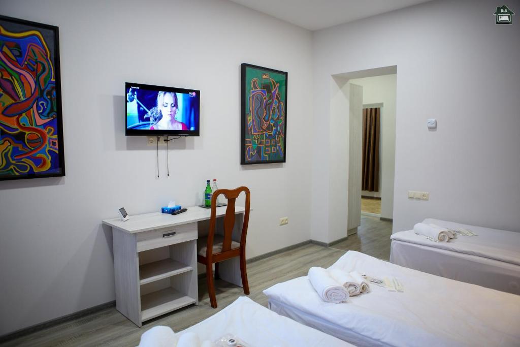 Postel nebo postele na pokoji v ubytování Gyurji Home - Guest House in Gyumri