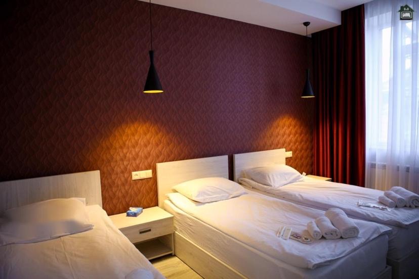 Postel nebo postele na pokoji v ubytování Guest House in Gyumri