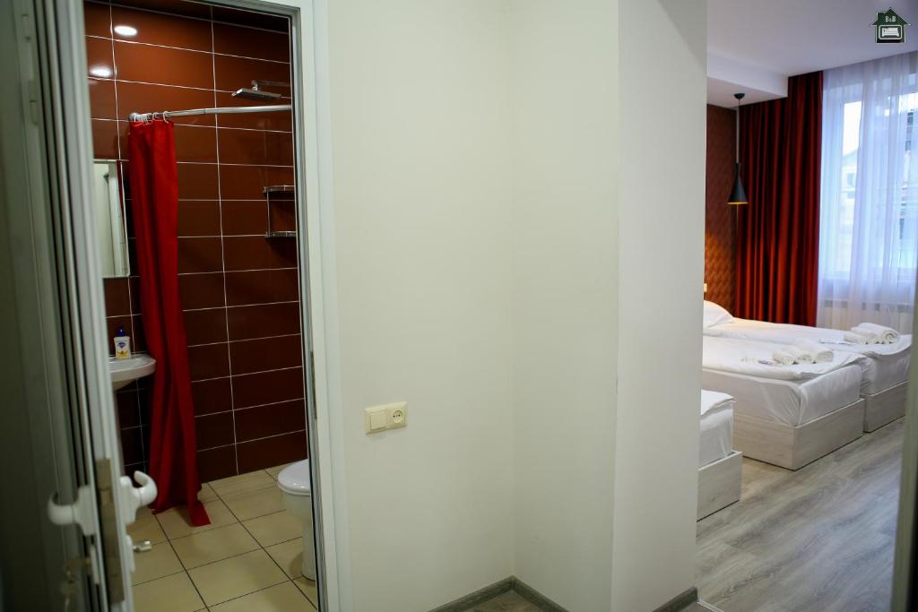 Postel nebo postele na pokoji v ubytování Guest House in Gyumri