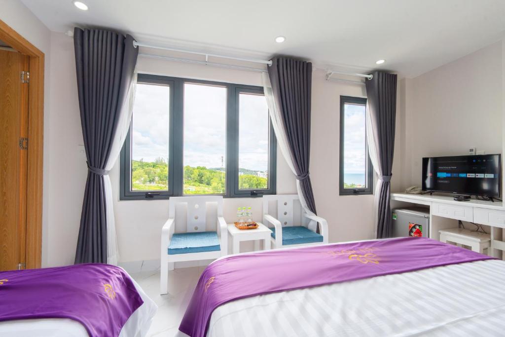 Кровать или кровати в номере Sen Hotel Phu Quoc