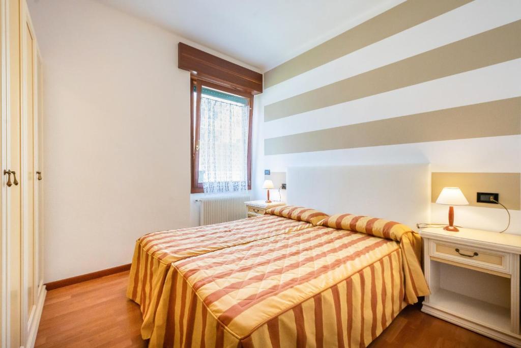 Кровать или кровати в номере Appartamenti Mare Caorle