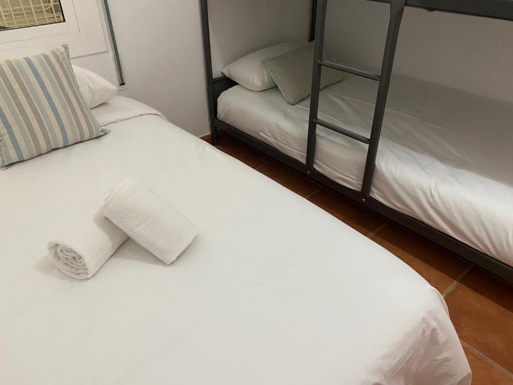 Postel nebo postele na pokoji v ubytování Vilamarlux V