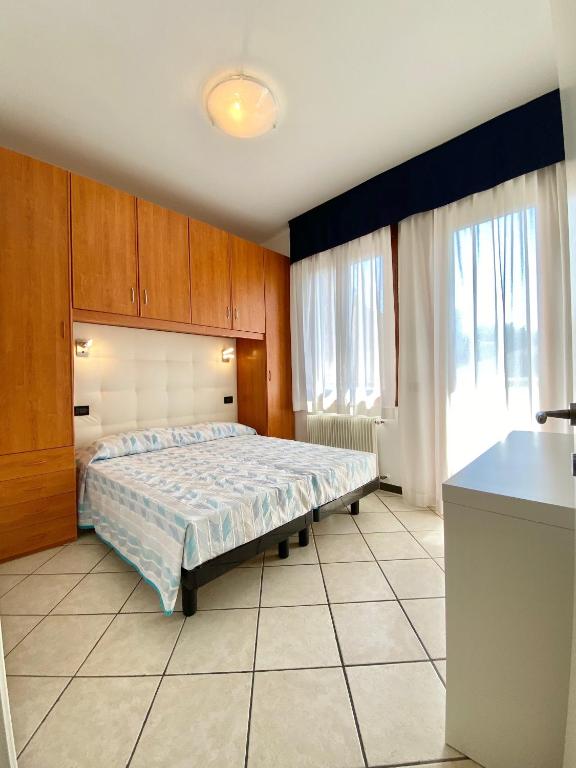 Кровать или кровати в номере Appartamenti Mare Caorle
