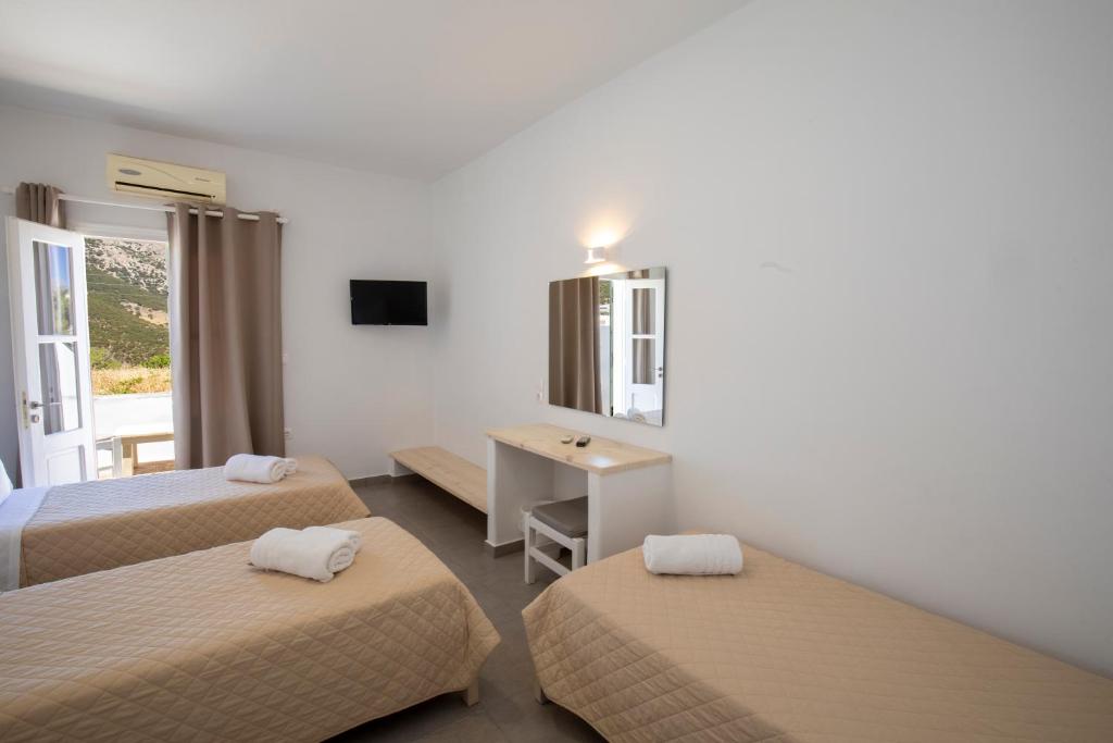 Postel nebo postele na pokoji v ubytování Hotel Galini Sifnos