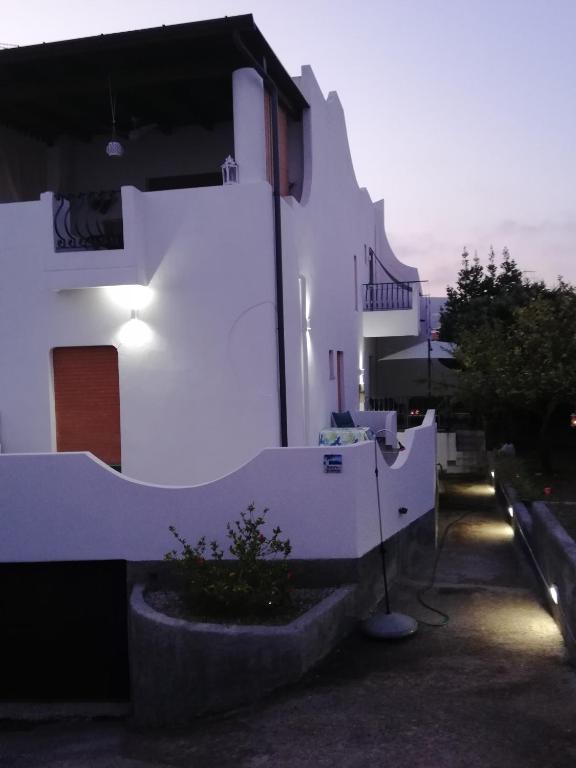a white building with a light on the side of it at Villetta Aurora in Lipari