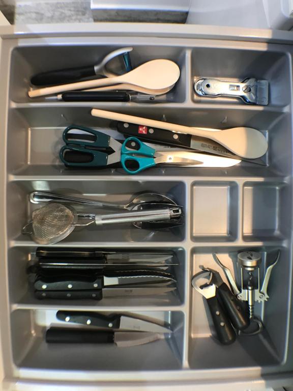 a drawer filled with lots of kitchen utensils at Apartmento Apartaclub La Barrosa 223 in Chiclana de la Frontera