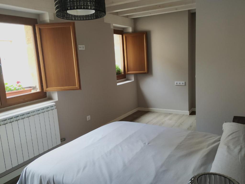 Postel nebo postele na pokoji v ubytování La Casa de las Tinas