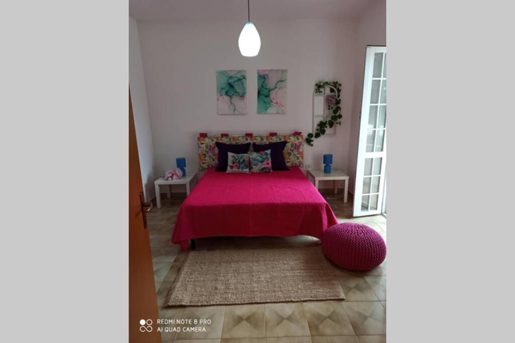 Ein Bett oder Betten in einem Zimmer der Unterkunft La rosa dei venti