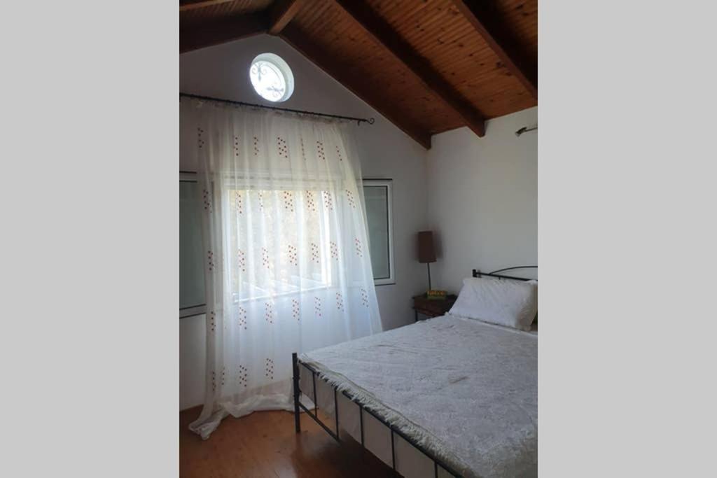 Postel nebo postele na pokoji v ubytování Σγουρής (Sgouris)