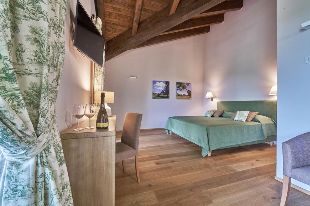 Postel nebo postele na pokoji v ubytování FORESTERIA DEL GAVI