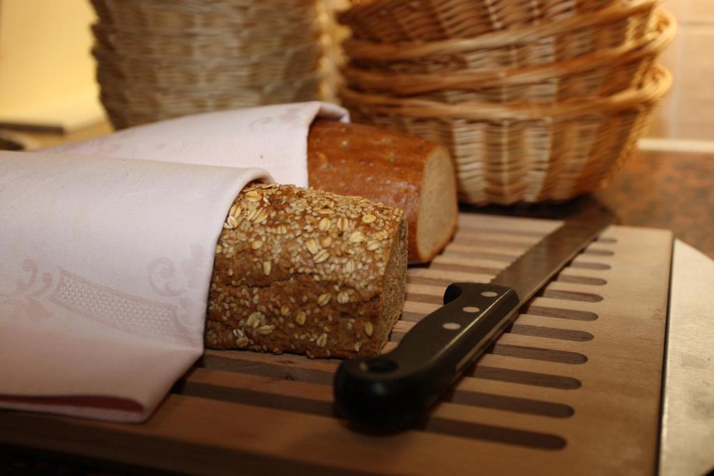 Postel nebo postele na pokoji v ubytování Hotel Garni Sonnenheim