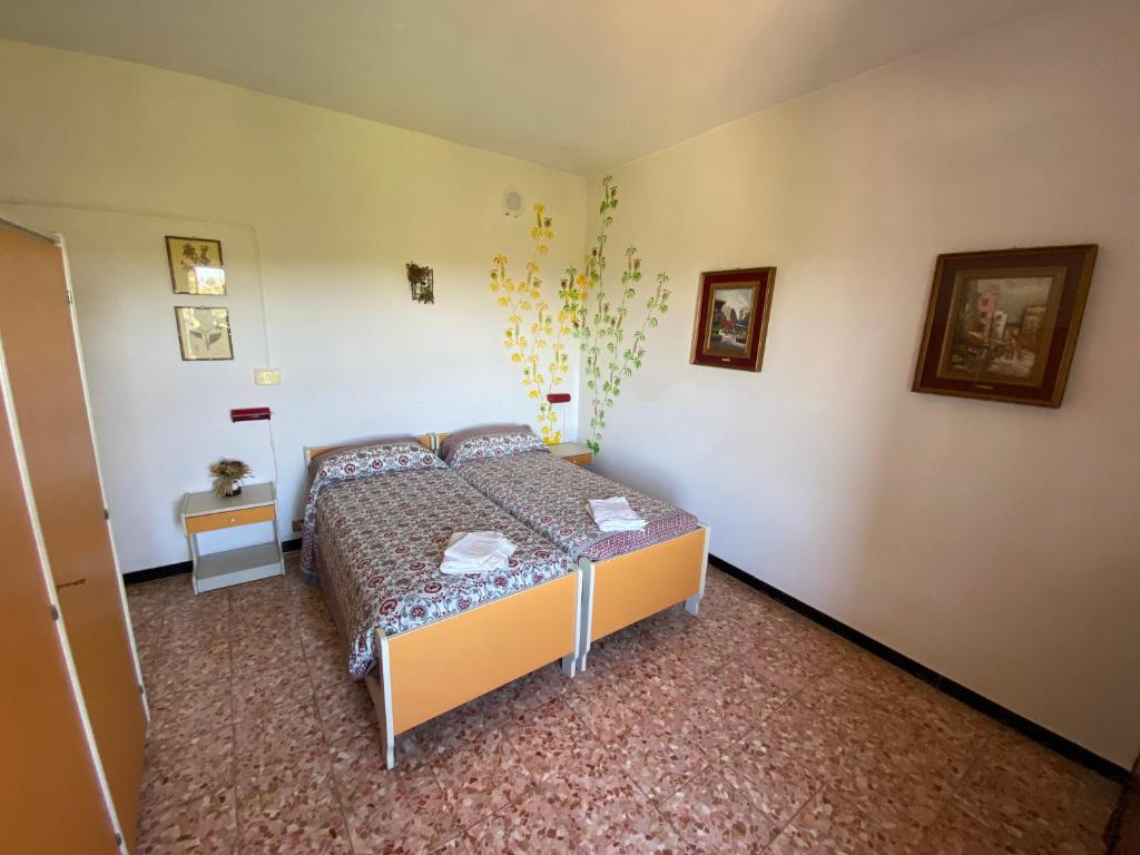 Postel nebo postele na pokoji v ubytování Appartamenti NeMoZo Moretti