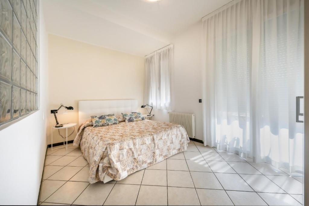 Кровать или кровати в номере Appartamenti Mare Caorle