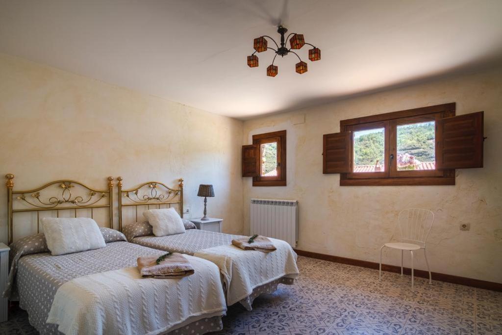 A bed or beds in a room at El Nogal De Laguna