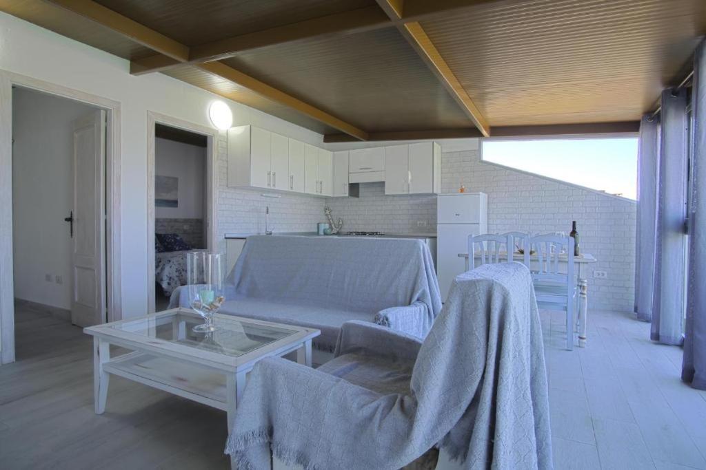 a living room with a couch and a table at ÁTICO LAS ALGAS in Granadilla de Abona