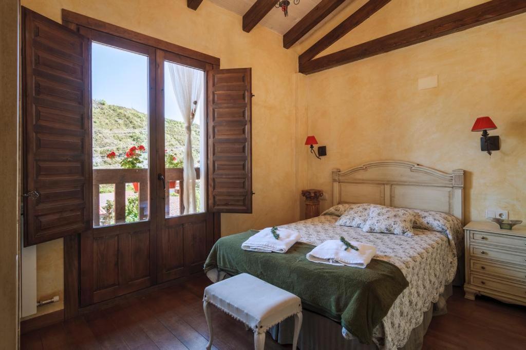 A bed or beds in a room at El Nogal De Laguna
