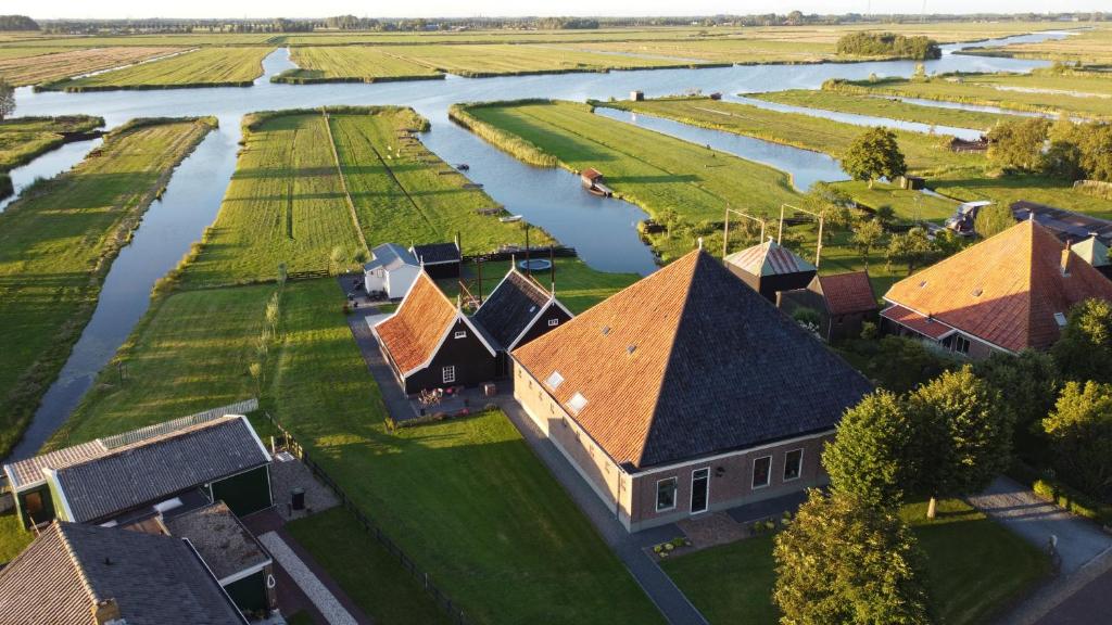 an aerial view of a house next to a river at Welcome in Jisp in Jisp