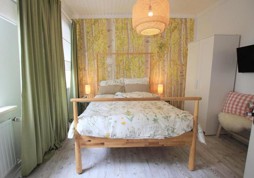 a bedroom with a wooden bed in a room at FerienNest Bad Ems, Appartment WaldNest in Bad Ems