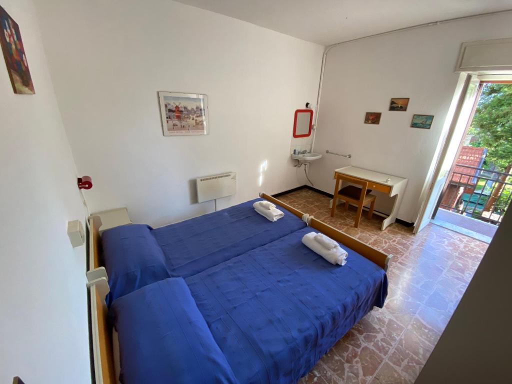 Postel nebo postele na pokoji v ubytování Appartamenti NeMoZo Moretti