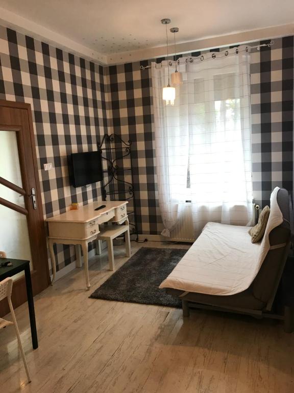 Telewizja i/lub zestaw kina domowego w obiekcie Vacation Apartments Sopot