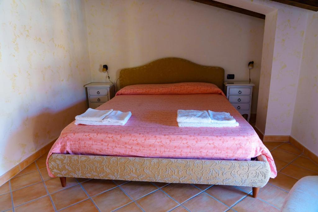 Postel nebo postele na pokoji v ubytování ANTICO FRANTOIO