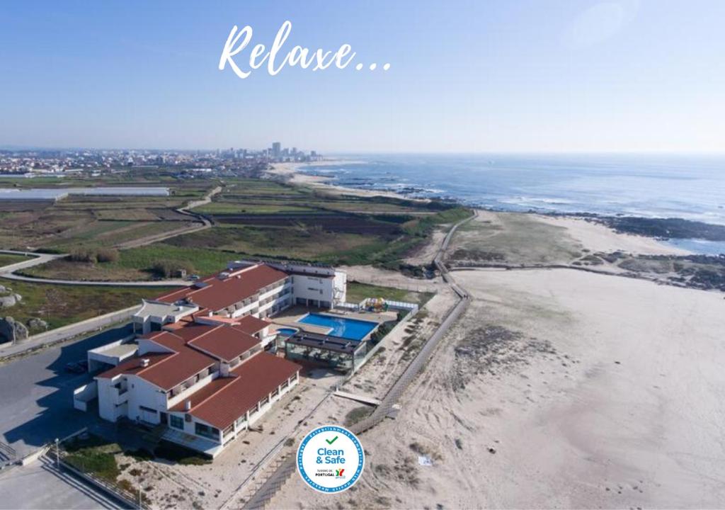 an aerial view of a building on the beach at Hotel Santo Andre in Póvoa de Varzim