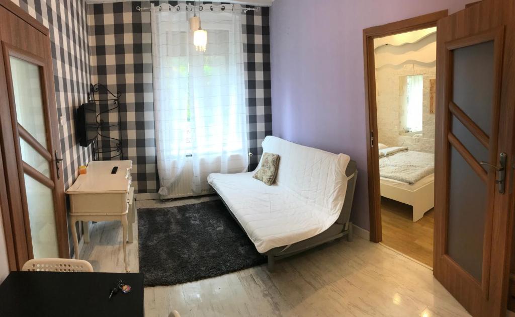 Łóżko lub łóżka w pokoju w obiekcie Vacation Apartments Sopot