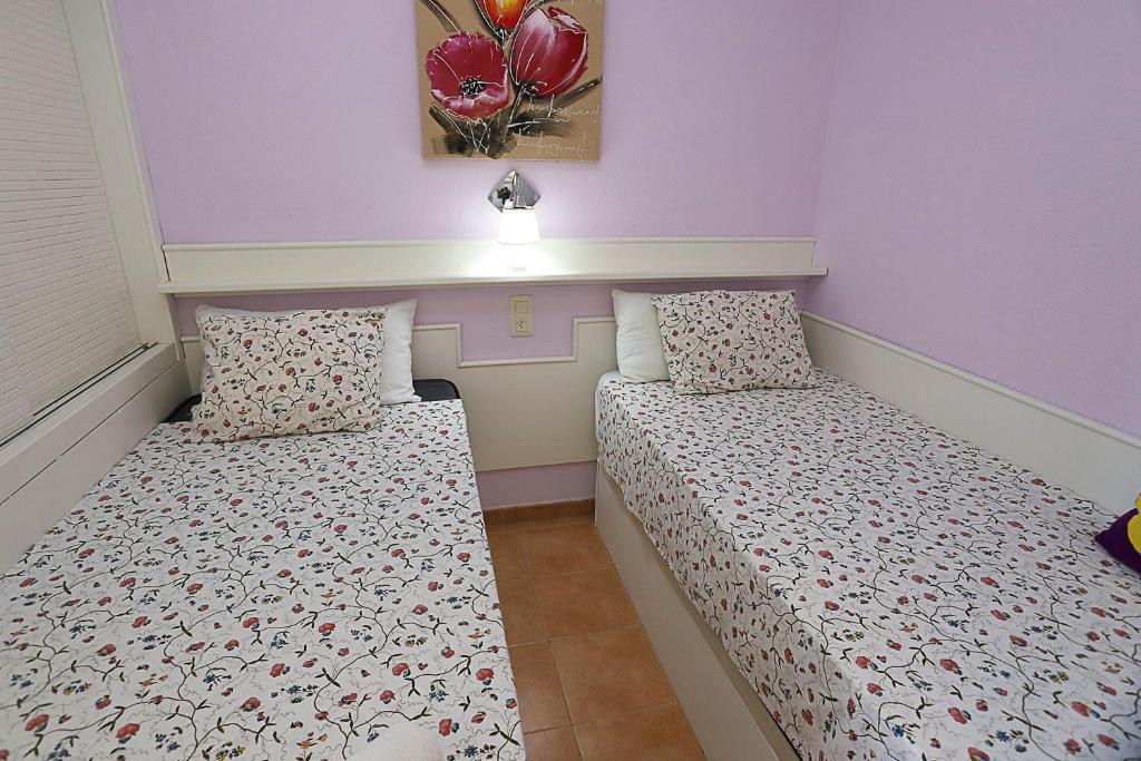 Posteľ alebo postele v izbe v ubytovaní COSTA DAURADA APARTAMENTS - Internacional Luxe