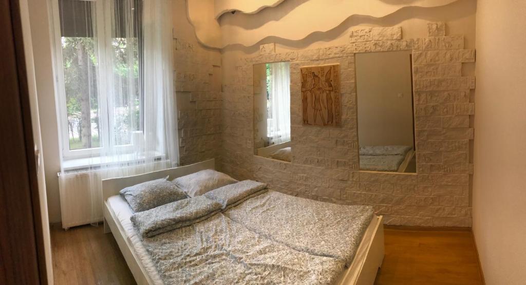 Łóżko lub łóżka w pokoju w obiekcie Vacation Apartments Sopot