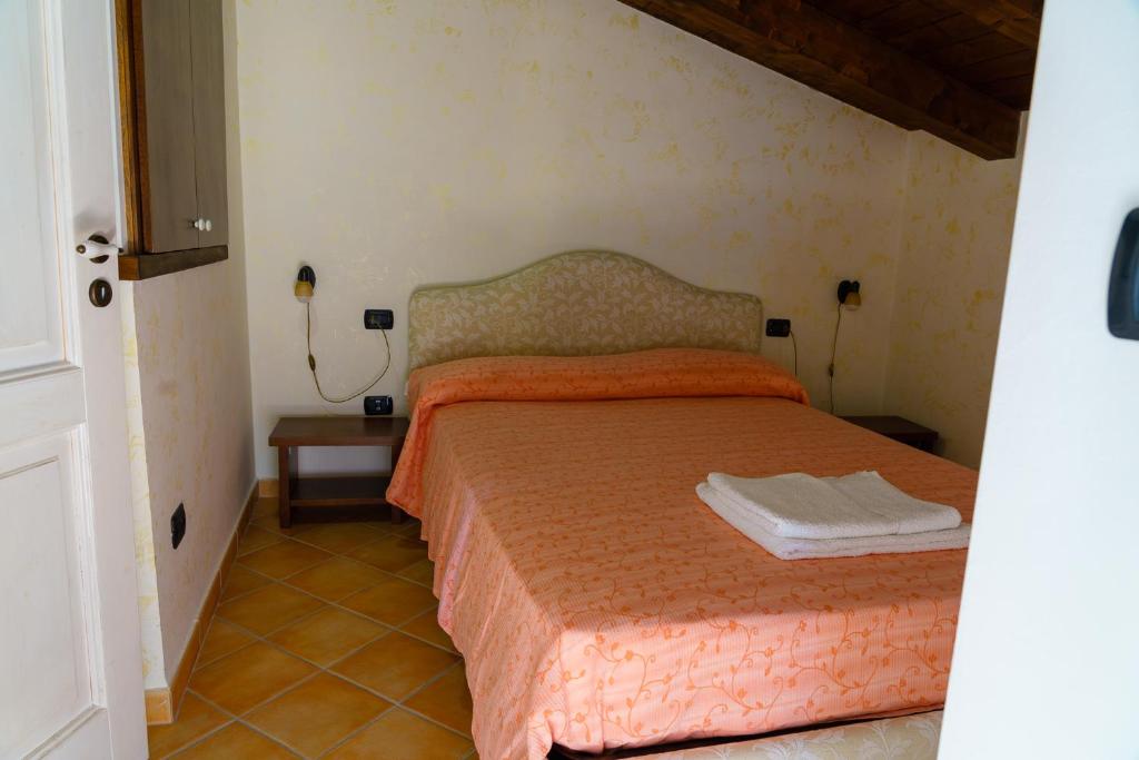 Postel nebo postele na pokoji v ubytování ANTICO FRANTOIO