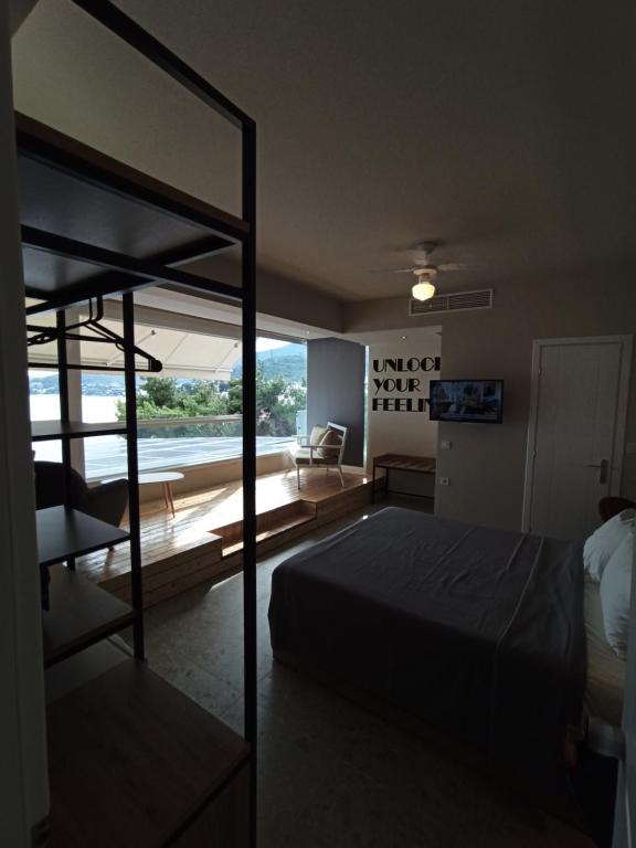 A bed or beds in a room at Porto Palio Beach Hotel