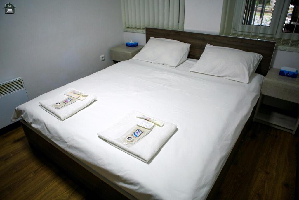 Postel nebo postele na pokoji v ubytování Guest House in Gyumri
