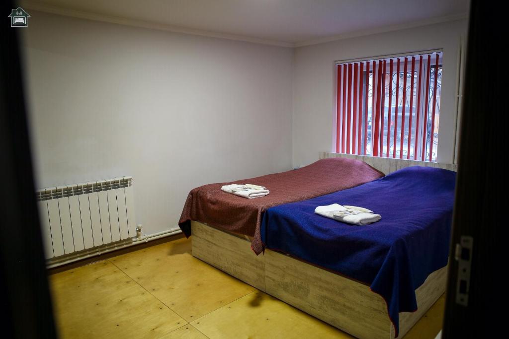 Postel nebo postele na pokoji v ubytování Guest House in Gyumri