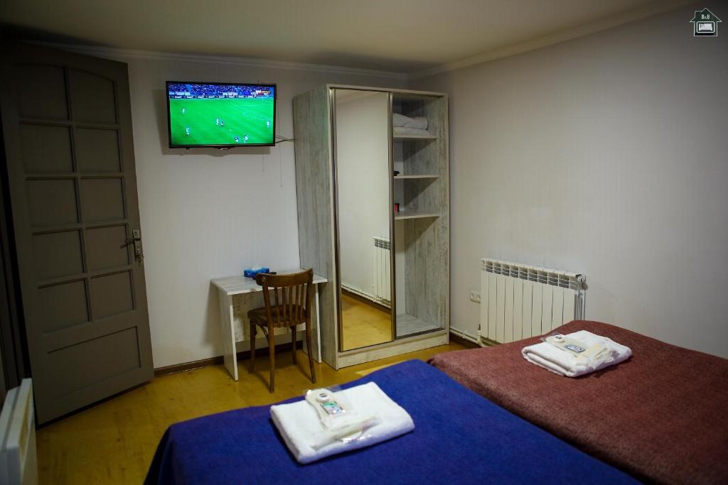 Postel nebo postele na pokoji v ubytování Guest House in Gyumri