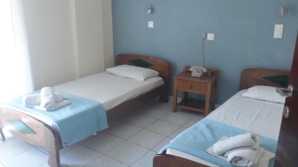 Postel nebo postele na pokoji v ubytování Hotel Lena