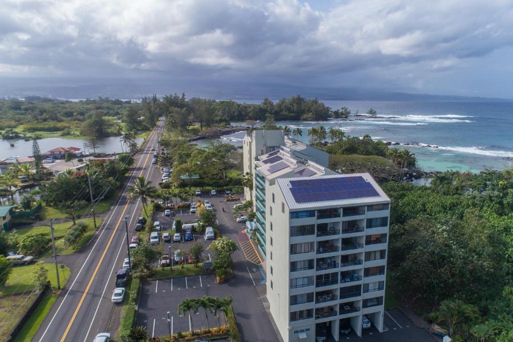 an aerial view of a building and the ocean at Mauna Loa Shores #405 condo in Hilo