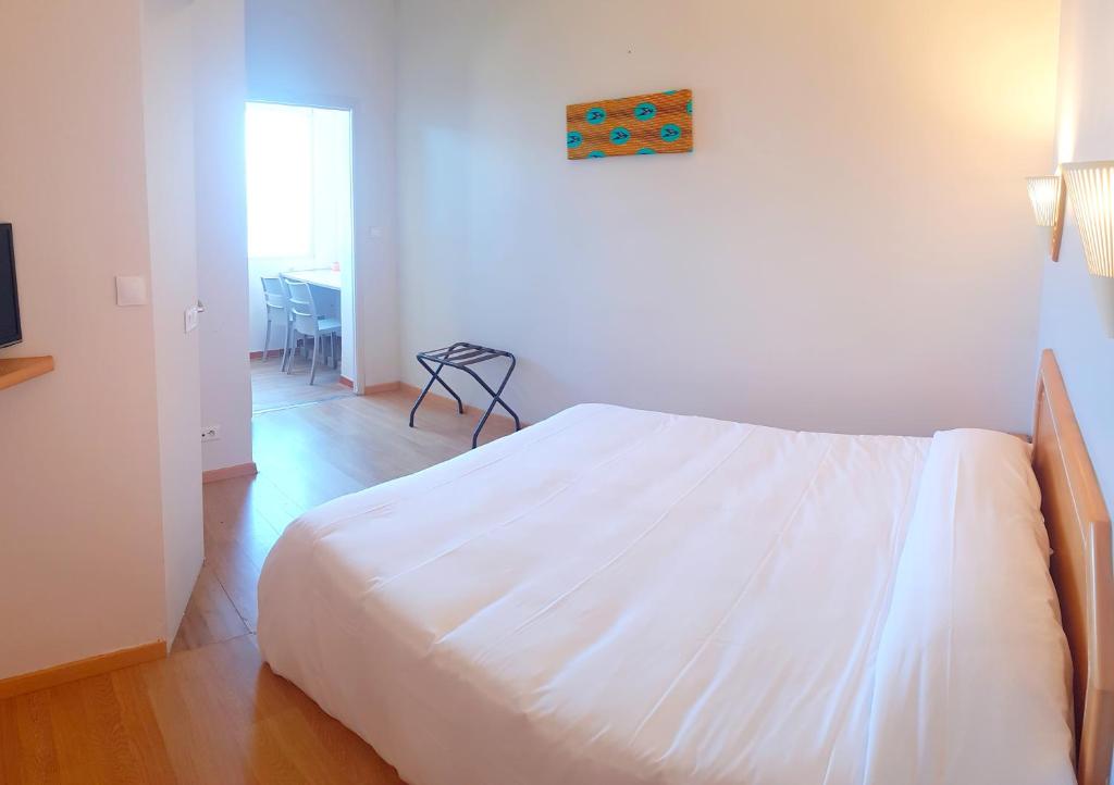 Postel nebo postele na pokoji v ubytování Hôtel Sole Mare