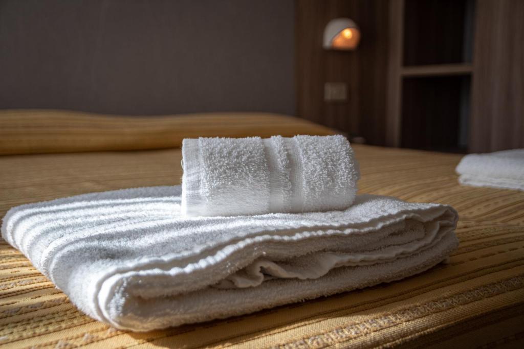 Postel nebo postele na pokoji v ubytování Hotel Astrid