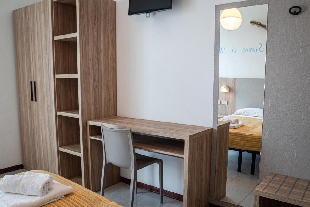 Postel nebo postele na pokoji v ubytování Hotel Astrid